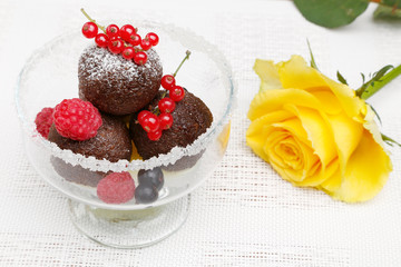 A delicious dessert with chocolate cake balls and fresh berries