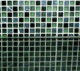 background of small ceramic tiles - wall with blue gray black mo