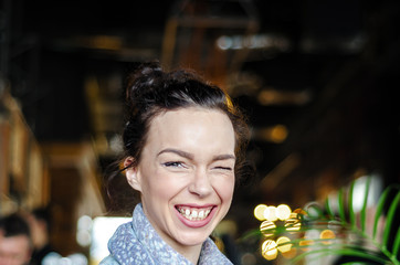 Woman with jeans jacket sitting in cafe