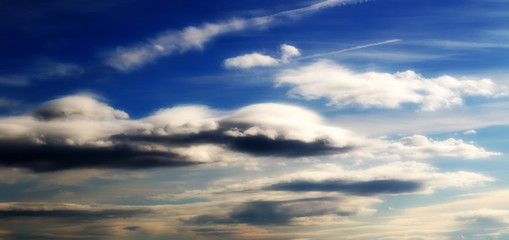dramatic clouds on blue sky background