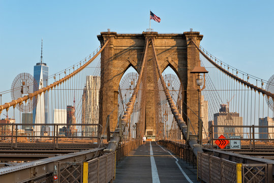 Fototapeta Brooklyn Bridge with flag on top