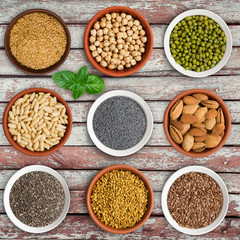 Large seed super food selection in bowls on a wooden background