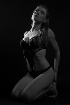 woman body in lingerie on black