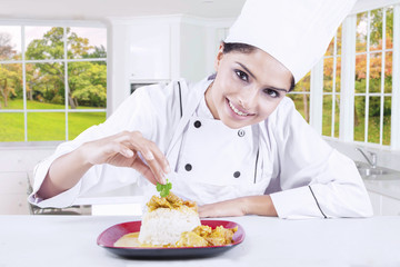 Female Chef Garnishing Food