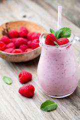 Raspberry milk shake with mint decor.