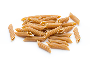 Rye flour macaroni pasta close up isolated on white.