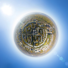 Aerial city view with crossroads and roads, houses, buildings, parks and parking lots, bridges. Copter shot. Panoramic image.