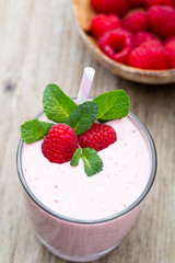 Raspberry milk shake with mint decor.