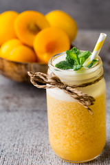 Plum smoothie, on the grey  background.