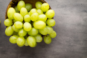 Grape cluster on the grey background.