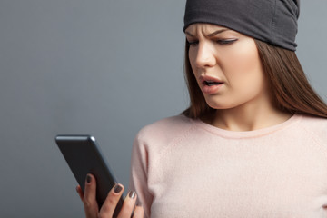 Pretty young girl is using her telephone