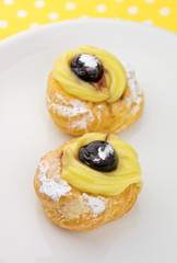 Zeppole - italian pastries on white plate