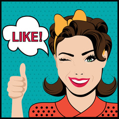 Pop art winking woman with thumbs up gesture 