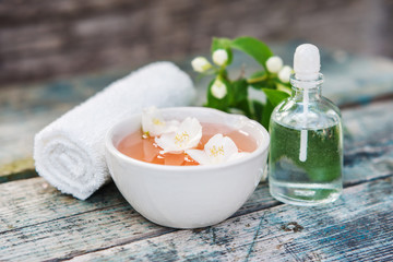 Spa and wellness setting with sea salt, oil essence, jasmin flow