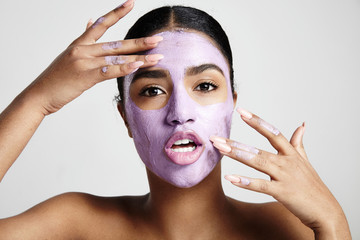 woman have fun with a facial mask
