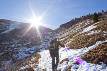 hiker in the snow in a sunny day