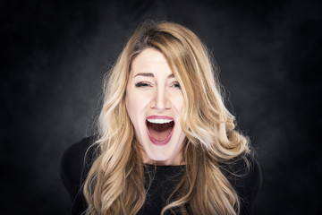 Blond women screaming.