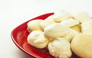 red plate with meringues