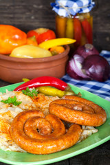 Roasted German style sausages with sour cabbage