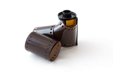 Cartridge of 35 mm negative photo film on white background