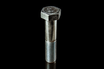 An isolated steel bolt on black background