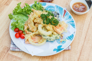 Japanese Food Tempura Mix ingredients are shrimp, carrot, pumpkin, eggplant and onion on wooden table.