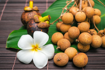 lichee with plumeria flower on bamboo background