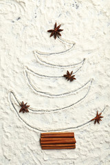 Christmas fir-tree from flour on a wooden table