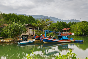 Fototapeta na wymiar THAILAND, KO CHANG. Thailand tropical island of Koh Chang. Fisherman's cottage in the mangrove trees