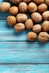Walnuts on a blue wooden table