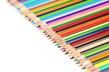 Drawing colourful pencils on a white background, close up
