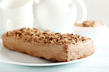 Chocolate cake on a blue wooden background