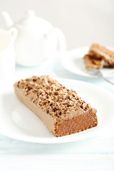 Chocolate cake on a blue wooden background