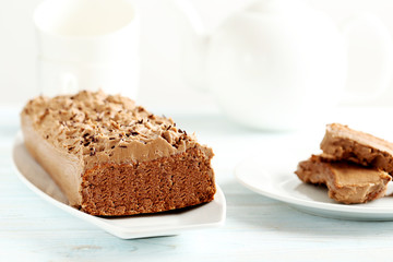 Chocolate cake on a blue wooden background