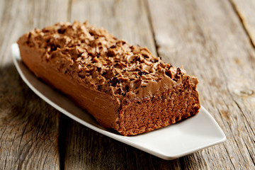 Fototapeta na wymiar Chocolate cake on a grey wooden background