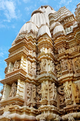 Stone carved erotic bas relief in Hindu temple in Khajuraho, India.