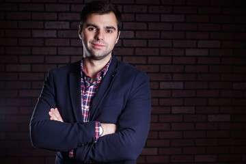Fototapeta premium portrait of handsome man in jacket and plaid shirt