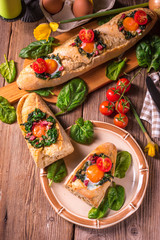 farmer baguette filled with egg, bacon and spinach