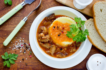 Delicious goulash with gravy and mashed potatoes. Traditional Hungarian cuisine.