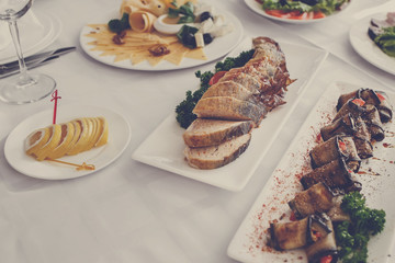 Banquet Table in restaurant served with different meals.