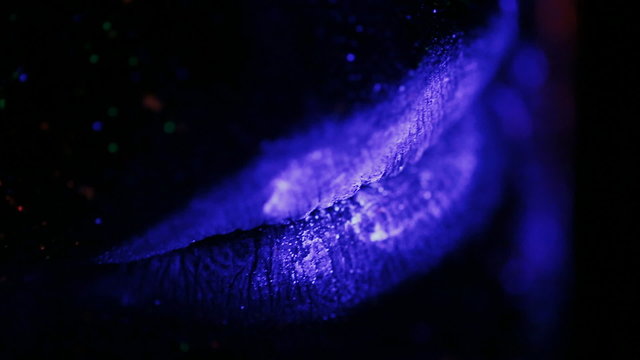 painted lips glow in ultraviolet light