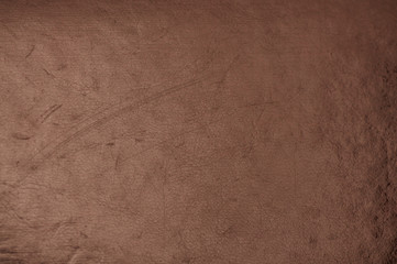 dark grunge scratched leather to use as background