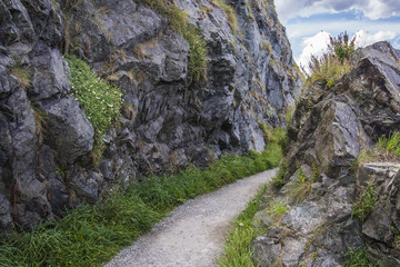 Fototapeta na wymiar Stone rocks mountain path at Irish seacoast. Bray, Greystone