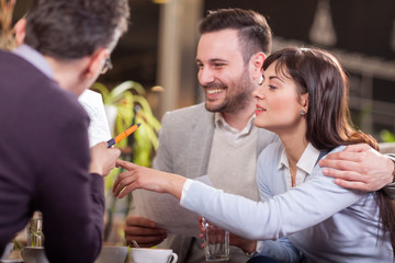 smiling group of business people in coffee shop