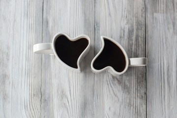 Two Heart Shaped cups with coffee