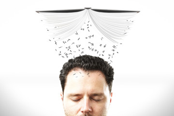 Studying concept with man head with opened book and flying lette