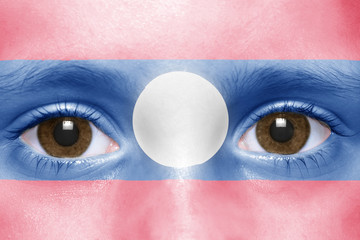 human's face with laotian flag