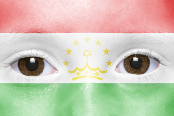 human's face with tajik flag