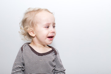 Naklejka premium Portrait Of Crying Baby Boy In Home