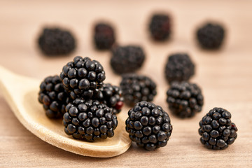 blackberries on a wooden spoon
